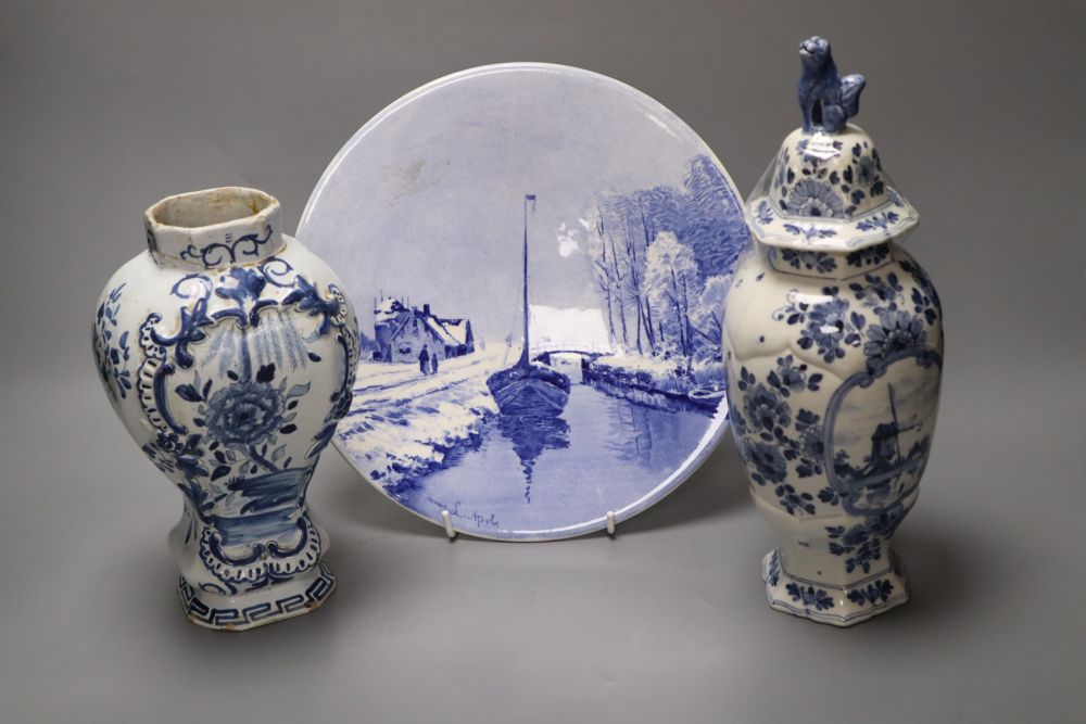 A delftware vase, 22cm, delft vase and a painted wall plate, 26cm